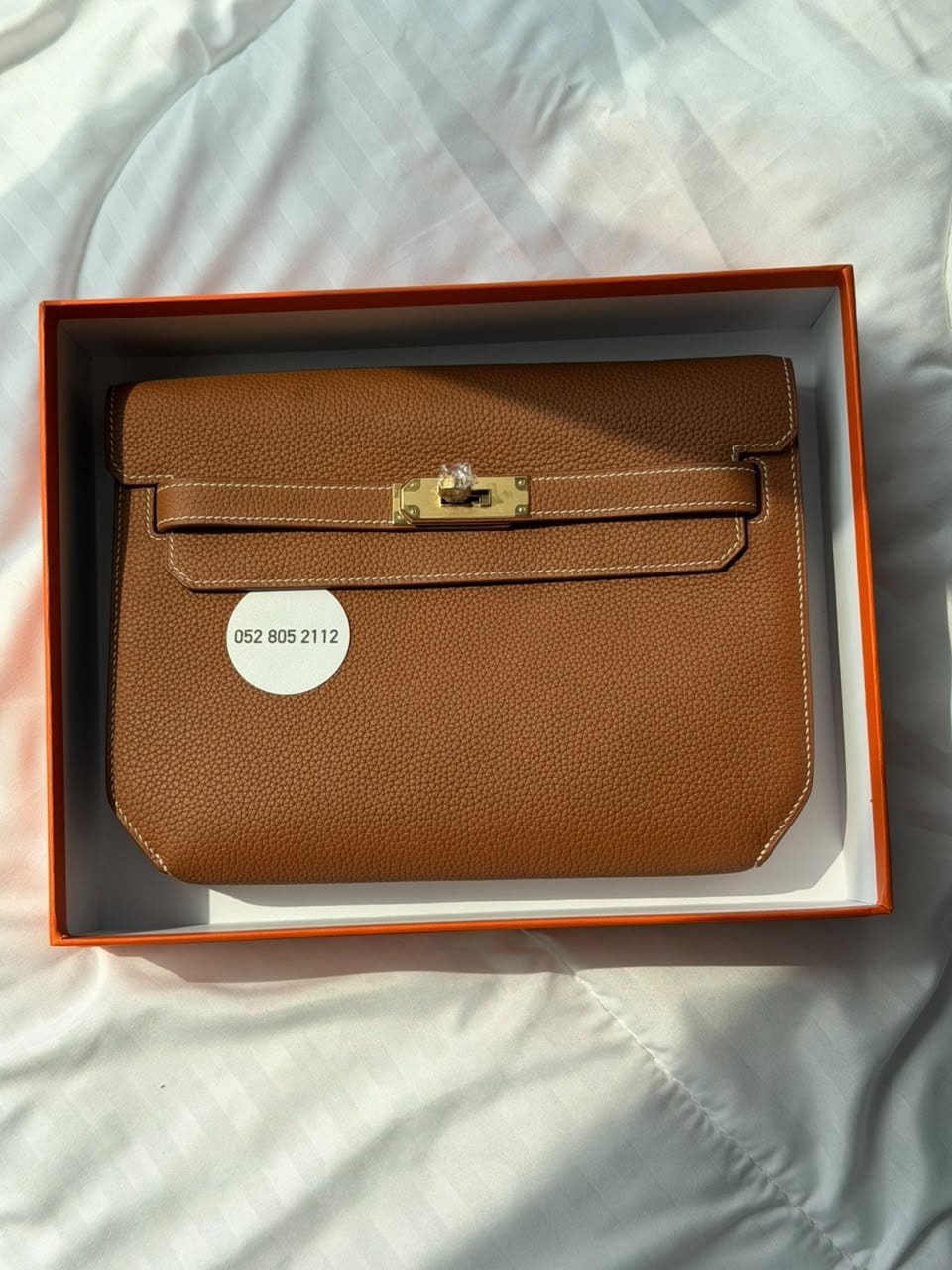 Hermès Kelly Depêches Pouch in Gold